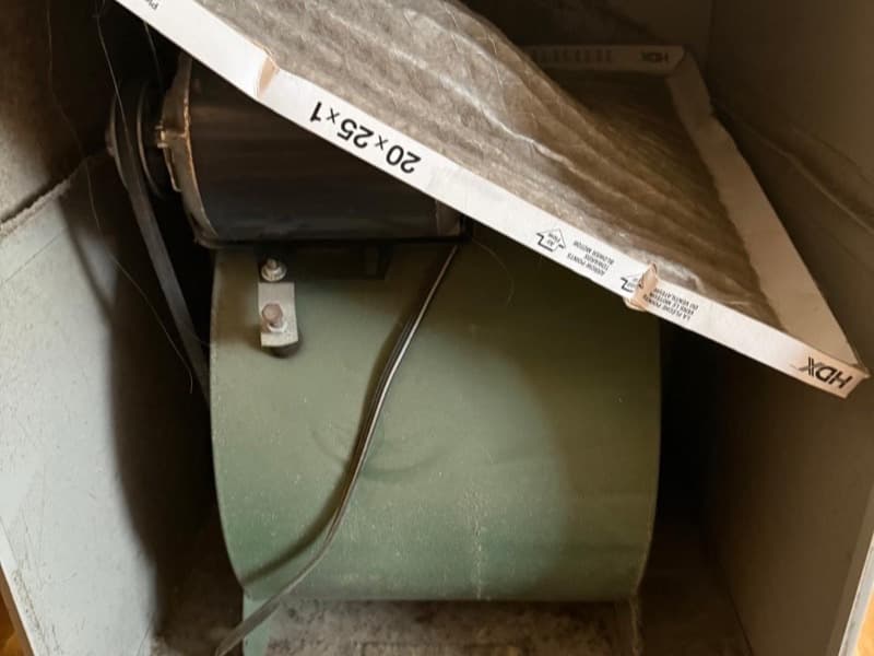 Dust-caked ducted system blower drum before cleaning